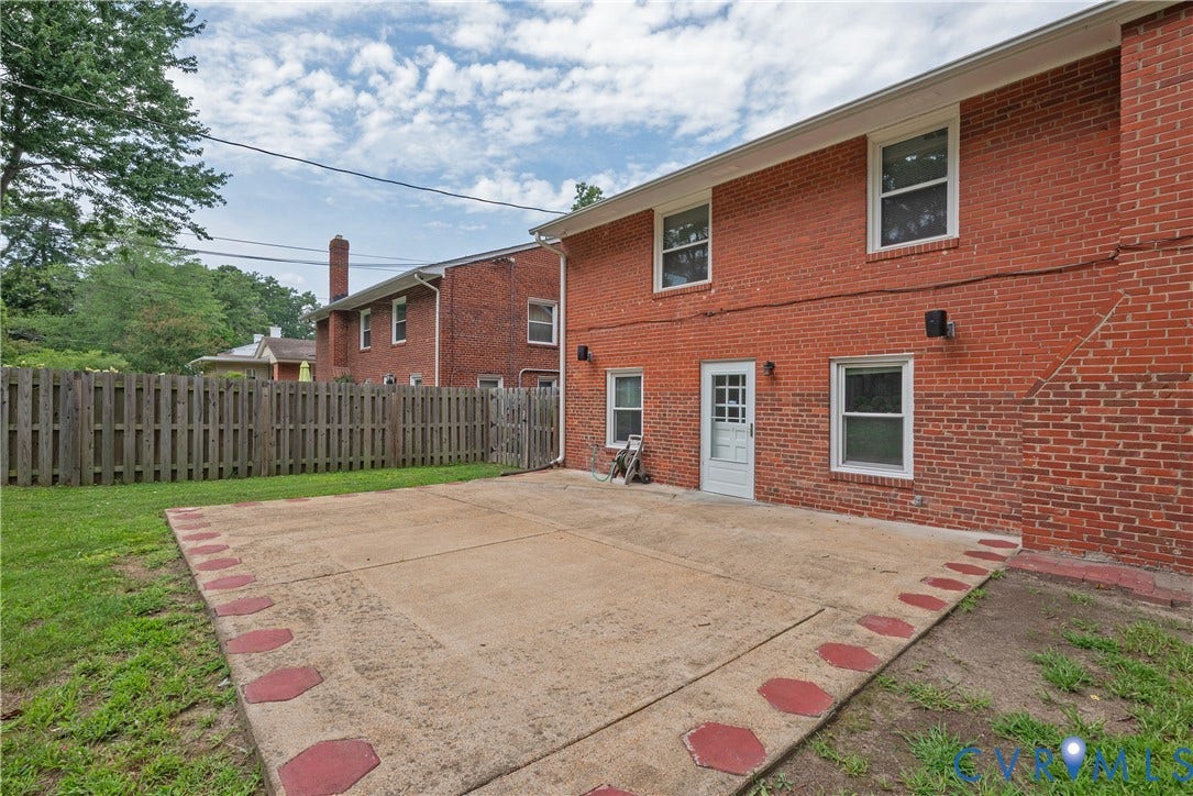 5709 Monument Avenue, Richmond, VA 23226 Patio - Brick exterior, rear door access, concrete patio, privacy fence