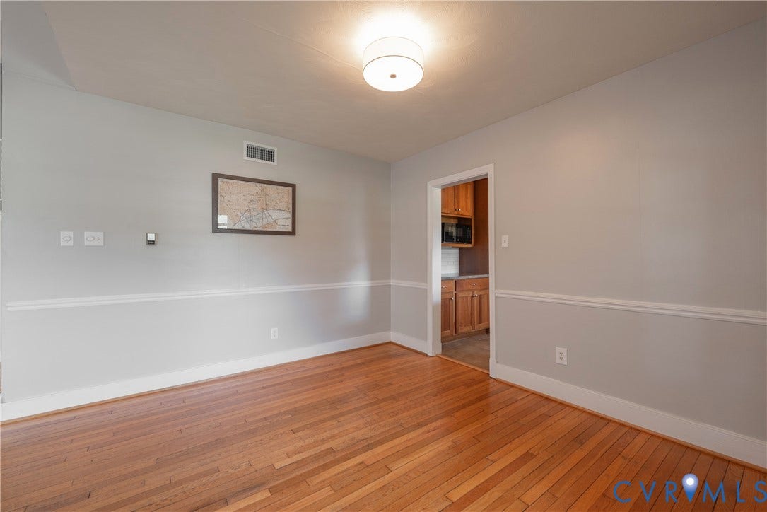 5709 Monument Avenue, Richmond, VA 23226 Hardwood flooring, light gray walls, white trim molding, recessed ceiling light fixture
