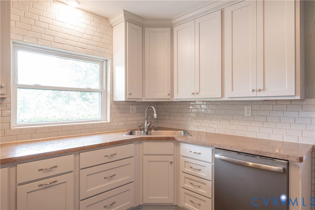 5709 Monument Avenue, Richmond, VA 23226 Kitchen with subway tile backsplash, stainless steel sink and contemporary faucet