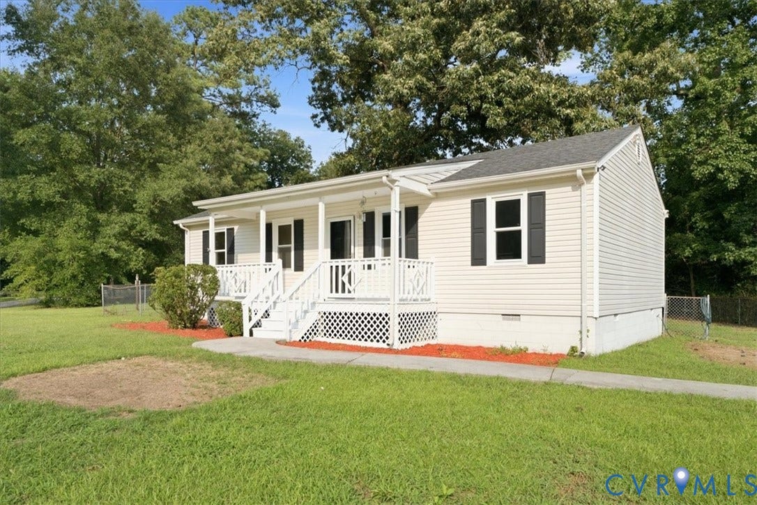 21103 Rabbit Run, Chesterfield, VA 23803 Single-story residence featuring white vinyl siding, a covered front porch with white railings, and black window shutters