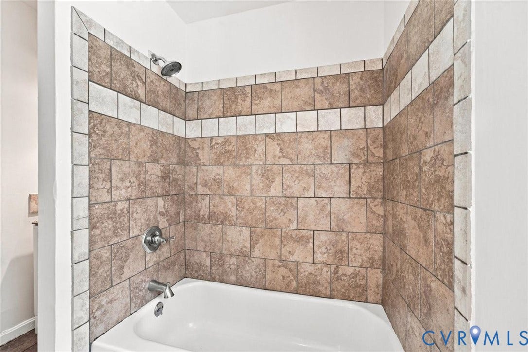 21103 Rabbit Run, Chesterfield, VA 23803 Tiled shower surround with decorative accent band and white bathtub