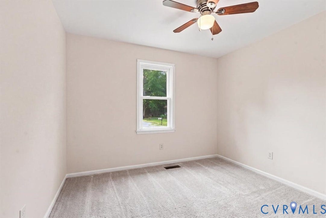 21103 Rabbit Run, Chesterfield, VA 23803 Neutral-toned walls, gray carpet flooring, white window frame, and a ceiling fan with light fixture