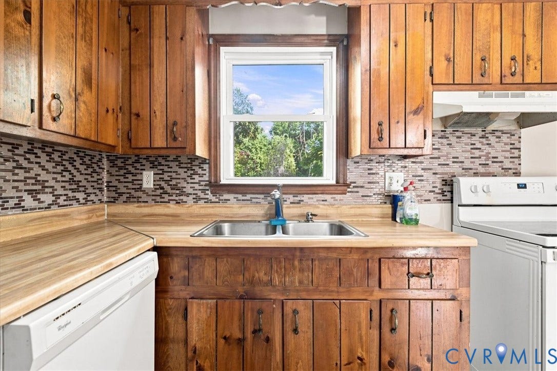 21103 Rabbit Run, Chesterfield, VA 23803 Wood cabinetry and countertop surfaces with a stainless steel double basin sink