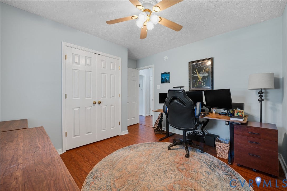 3117 Pinefields Drive, Henrico, VA 23231 Bedroom Two featuring Wood-finish flooring, ceiling fan with integrated lighting, paneled bifold closet doors
