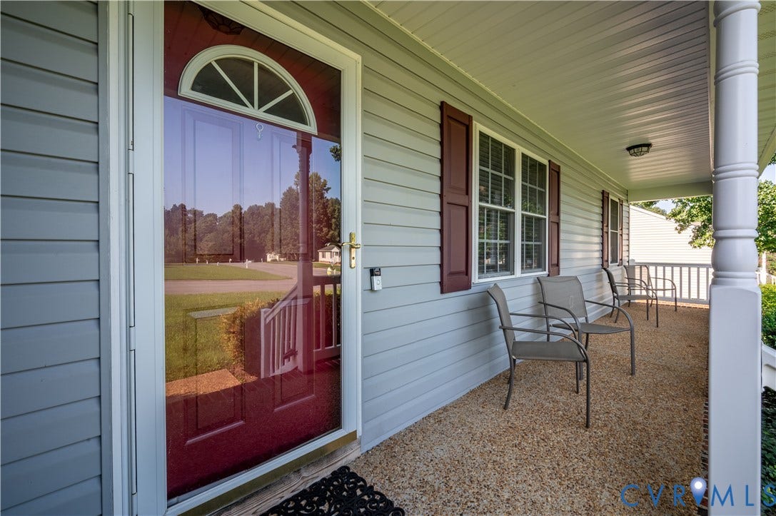 3117 Pinefields Drive, Henrico, VA 23231 Covered front porch featuring light gray siding and textured flooring