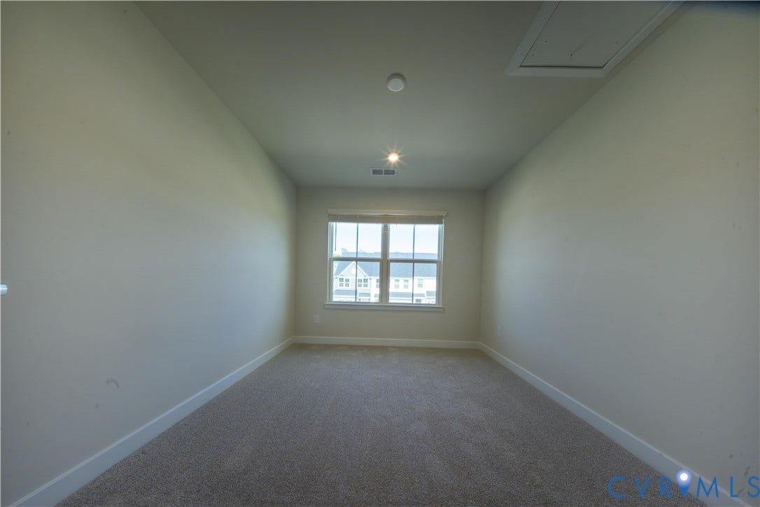 Recessed lighting, window with blinds, and neutral carpeting
