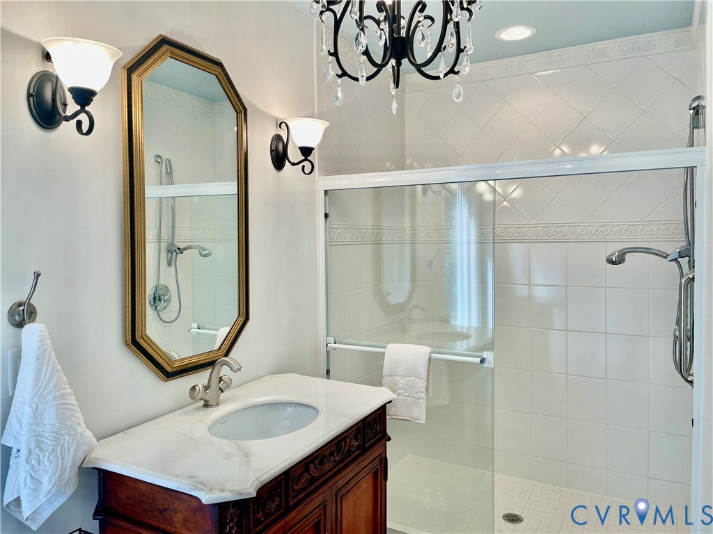 8208 Michael Road, Henrico, VA 23229 Walk-in shower with glass enclosure and tiled surround
