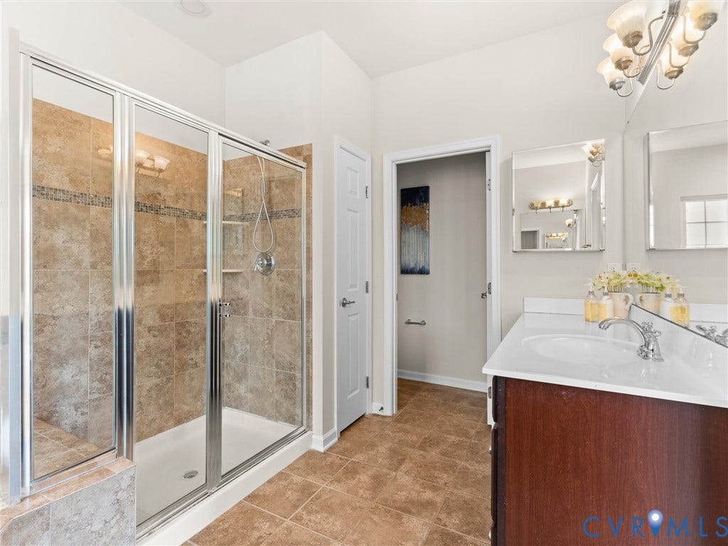 1901 Liesfeld Parkway, West Broad Village, Glen Allen, VA 23060 Glass-enclosed shower with tiled walls and a mosaic accent