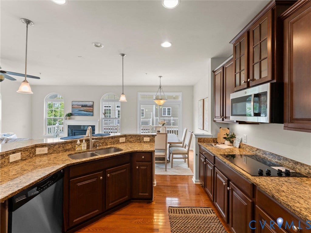 1901 Liesfeld Parkway, West Broad Village, Glen Allen, VA 23060 Kitchen featuring wood-finish flooring, dark wood cabinetry, and granite countertops
