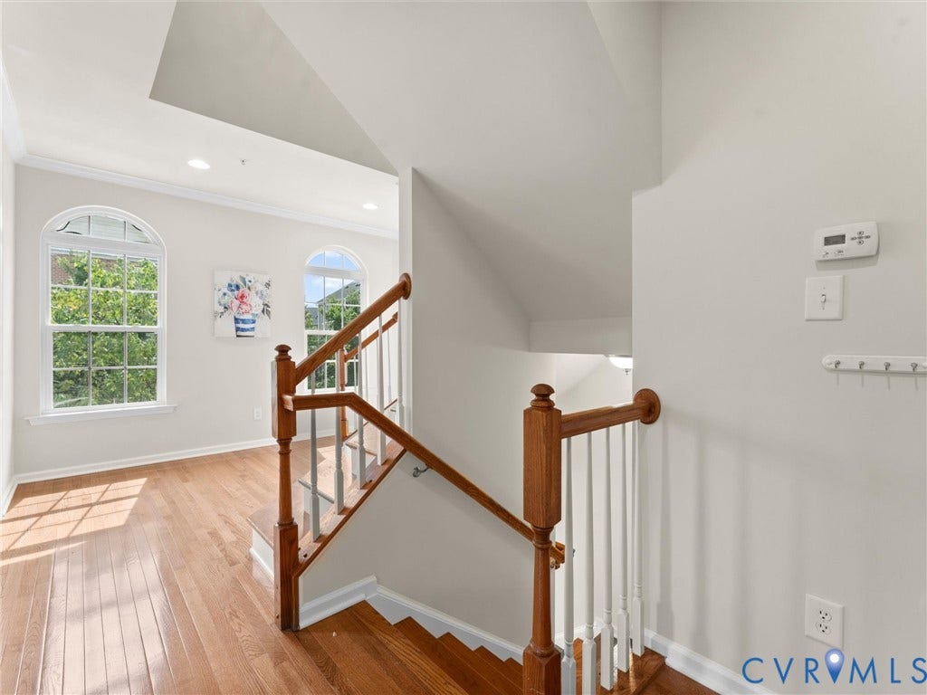 1901 Liesfeld Parkway, West Broad Village, Glen Allen, VA 23060 Wood-finish flooring, white walls, arched windows, recessed lighting, and wood-toned stair railing