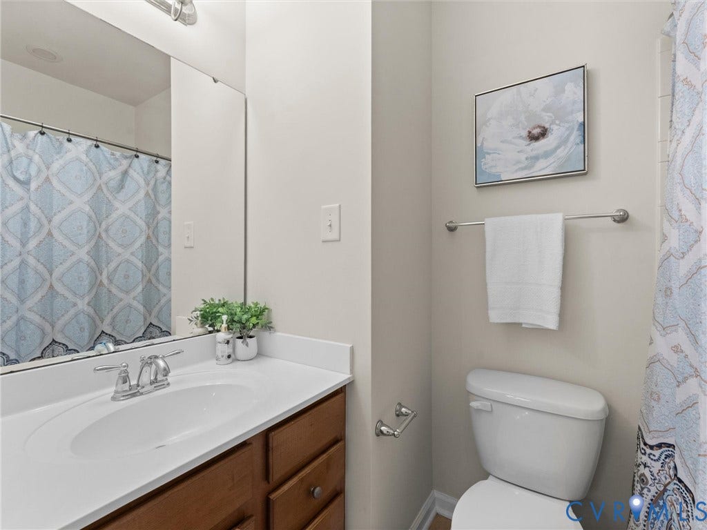 1901 Liesfeld Parkway, West Broad Village, Glen Allen, VA 23060 Vanity with an integrated sink, polished chrome faucet, and ample under-sink storage