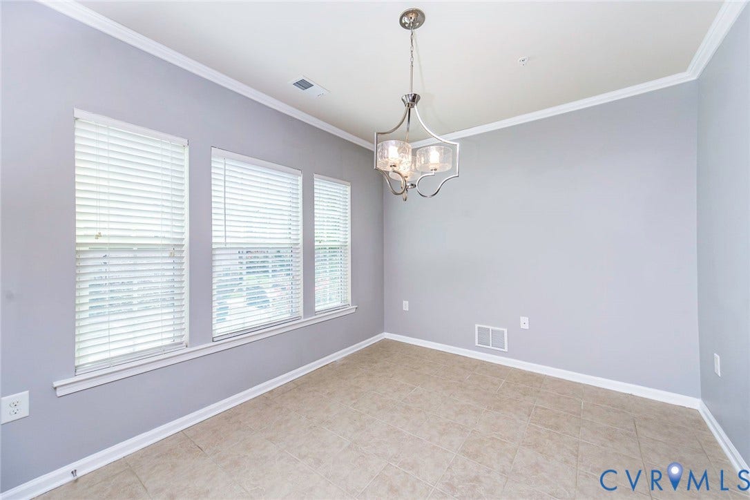Recessed lighting, tile flooring, and crown molding