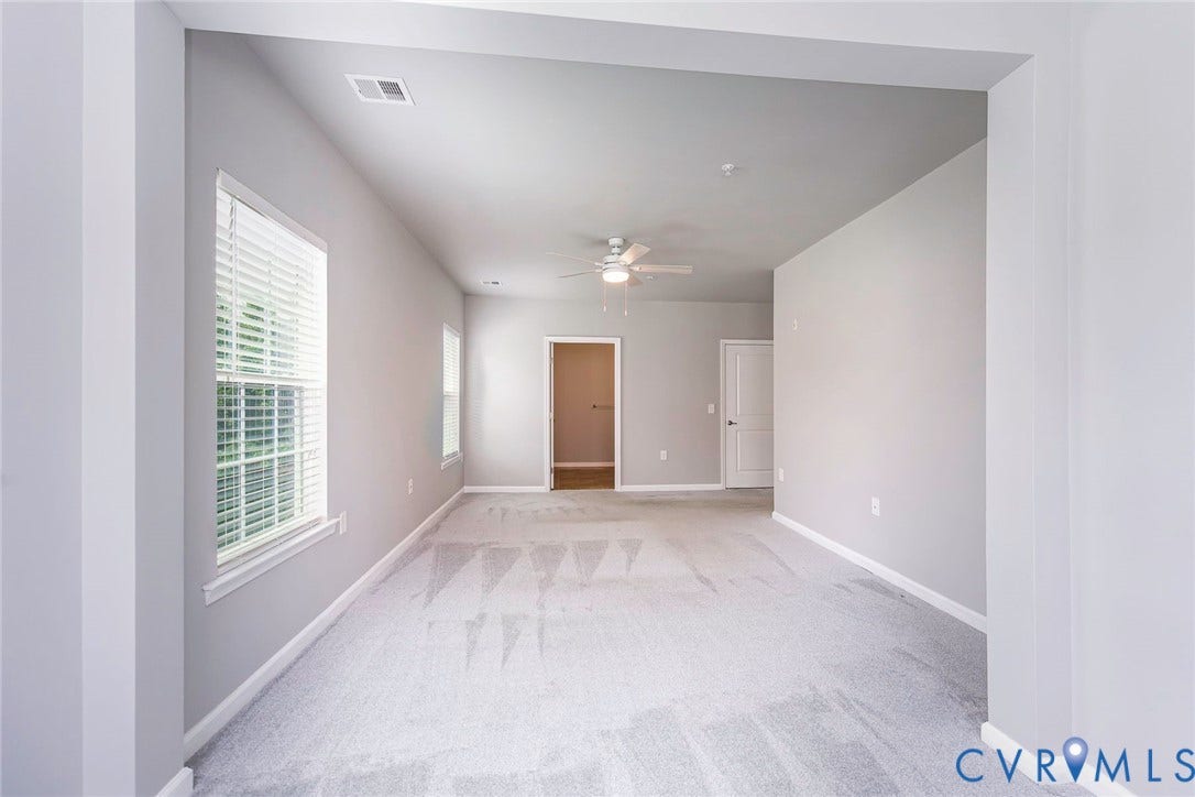 From the sitting area you can see just how large this Primary Suite is!