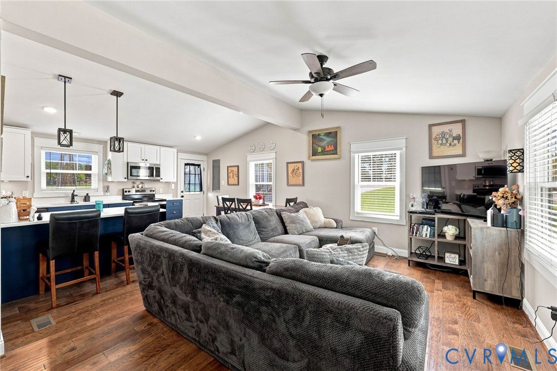 1108 Schroeder Road, Powhatan, VA 23139 Open-concept living area featuring wood-finish flooring, vaulted ceiling, and recessed lighting