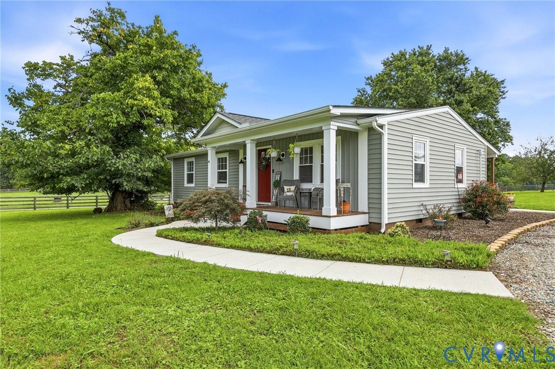 1108 Schroeder Road, Powhatan, VA 23139 Light gray siding exterior with a red entry door, covered porch, and white columns