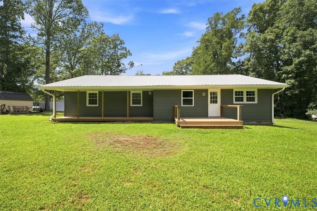 2338 Georges Road, Powhatan, VA 23139 Level backyard with covered porch and deck.