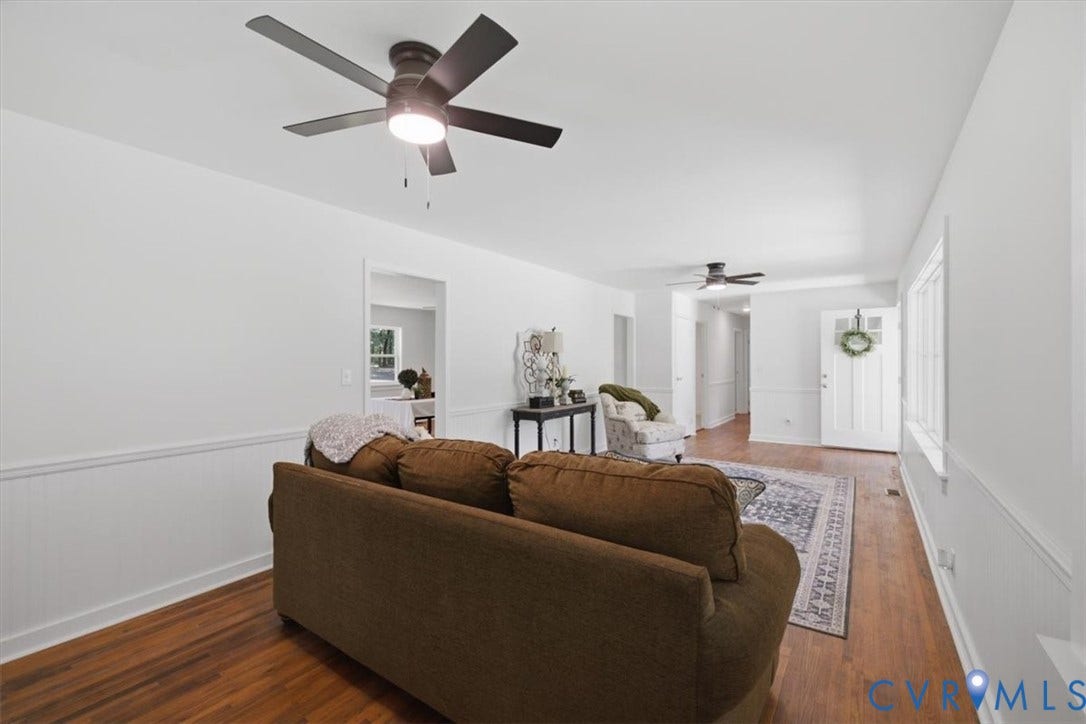 2338 Georges Road, Powhatan, VA 23139 Hardwood flooring, white wainscoting, recessed lighting, and ceiling fans