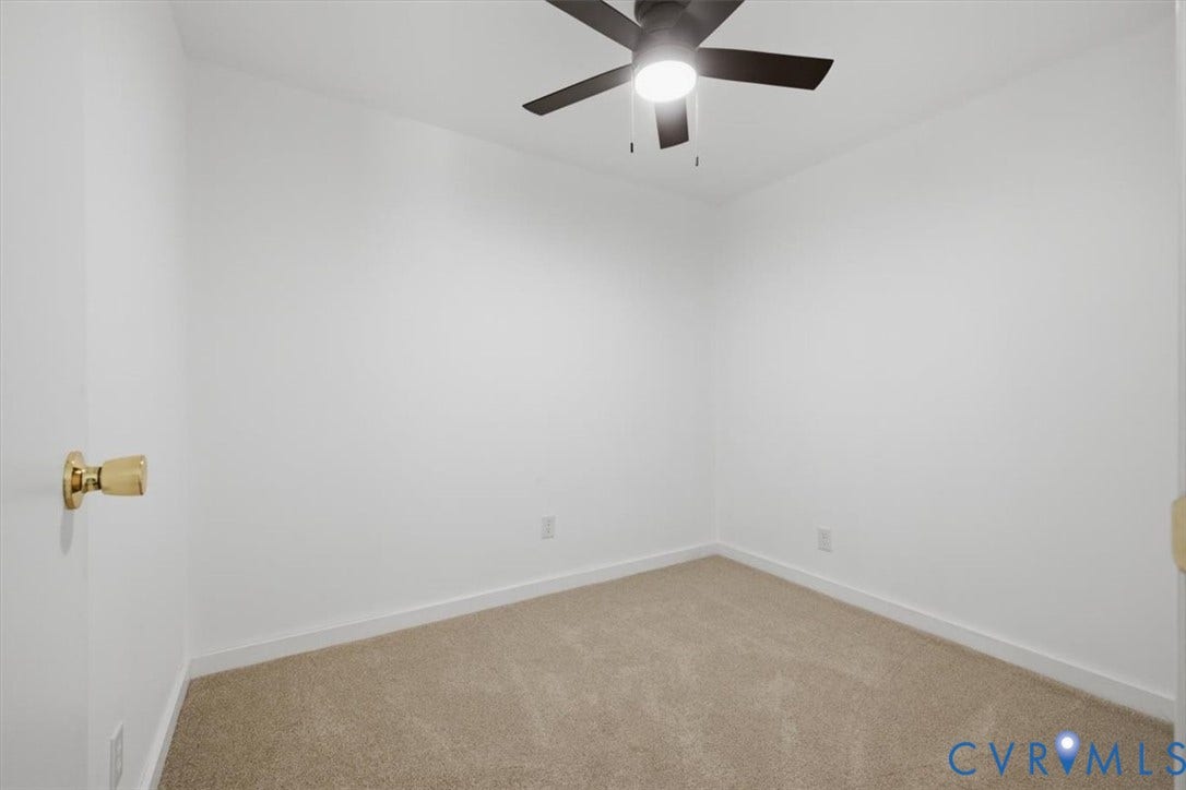 2338 Georges Road, Powhatan, VA 23139 Neutral wall color, carpeted flooring, and a ceiling fan with integrated lighting