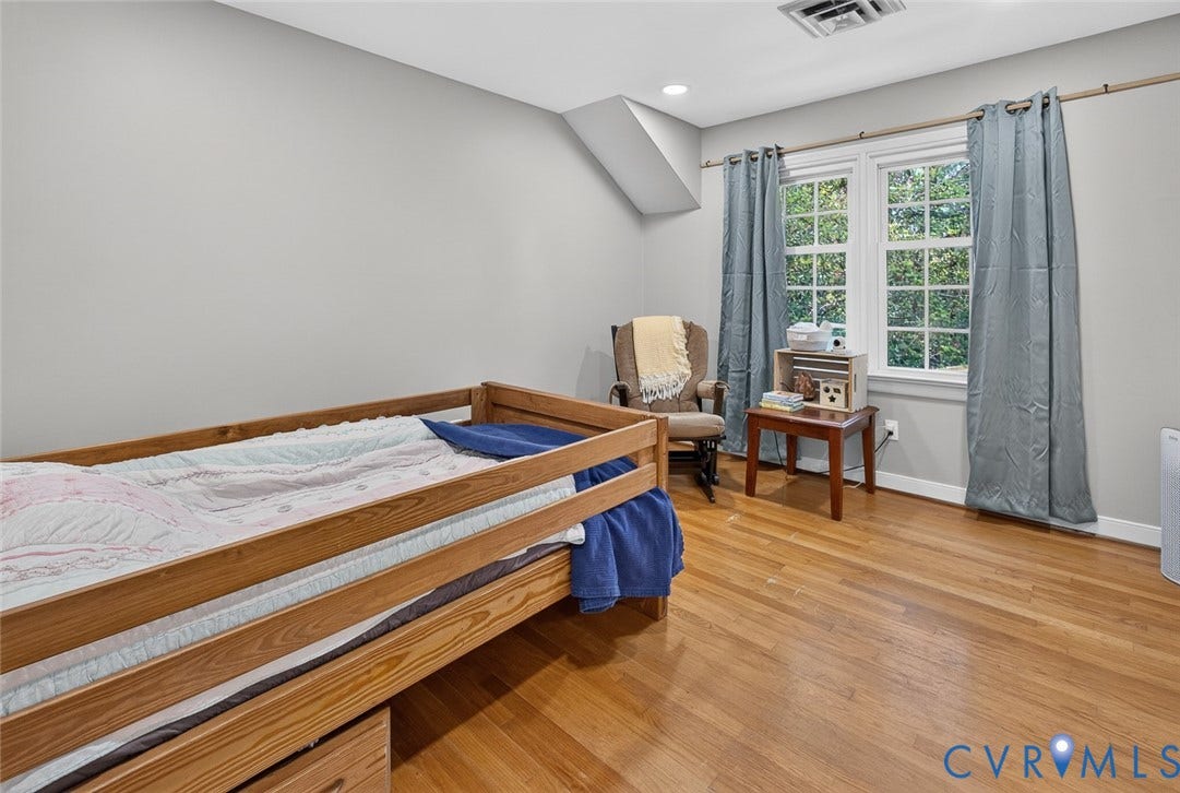 Hardwood flooring, dual pane windows, recessed lighting, and neutral wall tones
