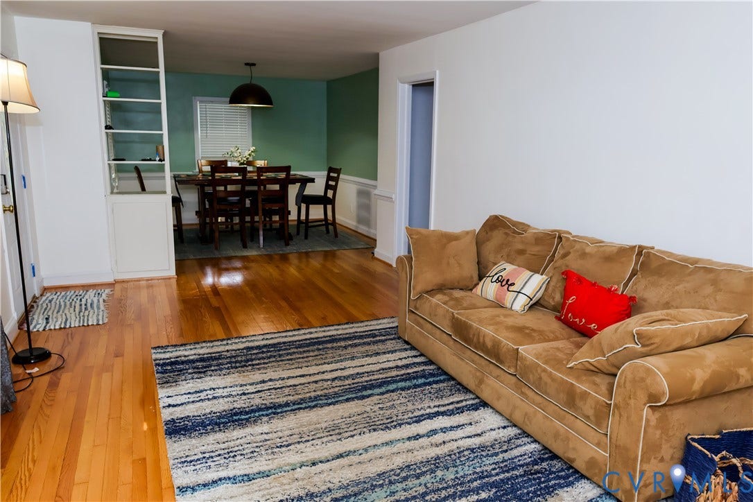 4941 Hopkins Road, Chesterfield, VA 23234 Hardwood flooring throughout, built-in shelving, and a distinct dining area with wainscoting