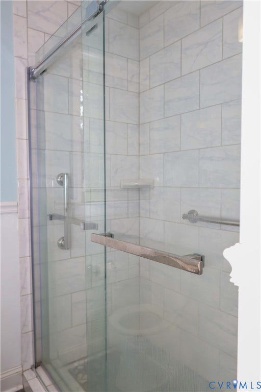 4941 Hopkins Road, Chesterfield, VA 23234 Glass-enclosed shower with tile walls.