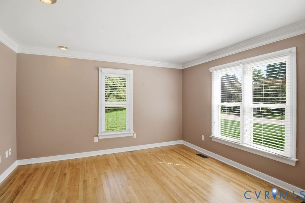 8806 Thornton Heath Drive, Chesterfield, VA 23832 Hardwood flooring, painted walls, white crown molding, recessed lighting, and multiple windows