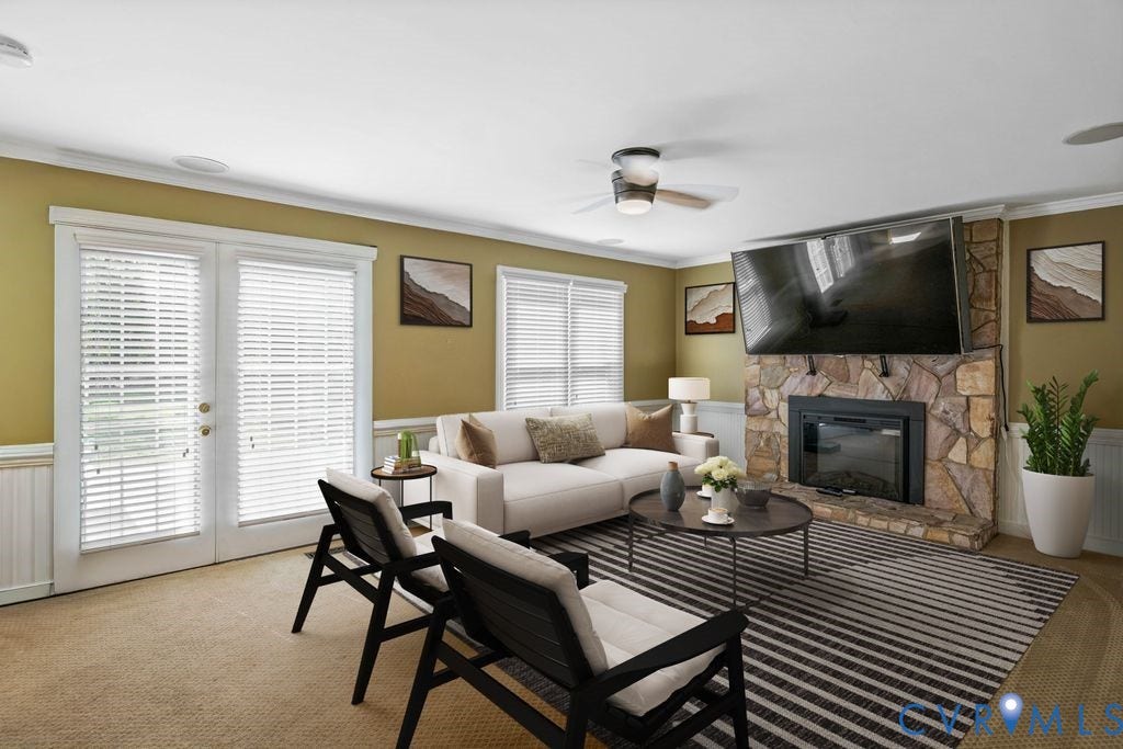 8806 Thornton Heath Drive, Chesterfield, VA 23832 Stone-clad fireplace with black insert, double French doors, wood-finish ceiling fan, recessed lighting, and wall-mounted television