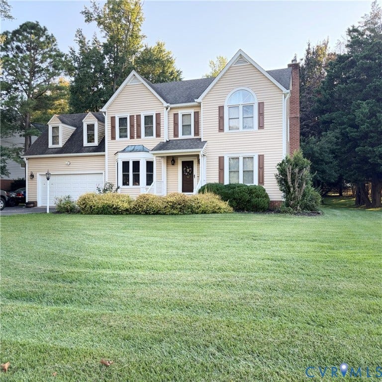 8806 Thornton Heath Drive, Chesterfield, VA 23832 Traditional two-story home with light-toned siding, dark shutters, and a prominent front gable