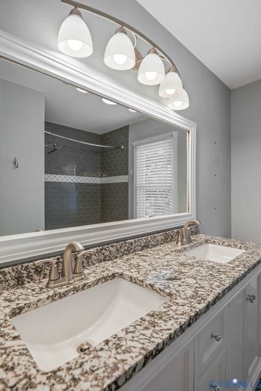8806 Thornton Heath Drive, Chesterfield, VA 23832 Double vanity with granite-style countertop, dual undermount sinks, and brushed nickel fixtures