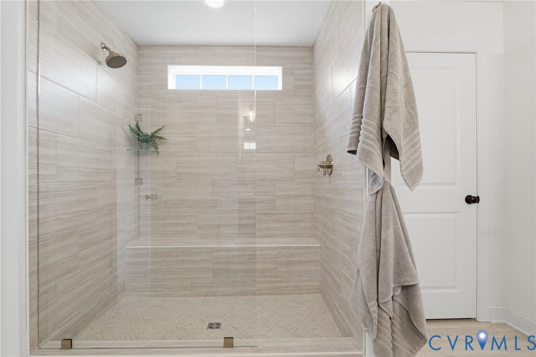 Primary Bathroom -Photo represents the actual home