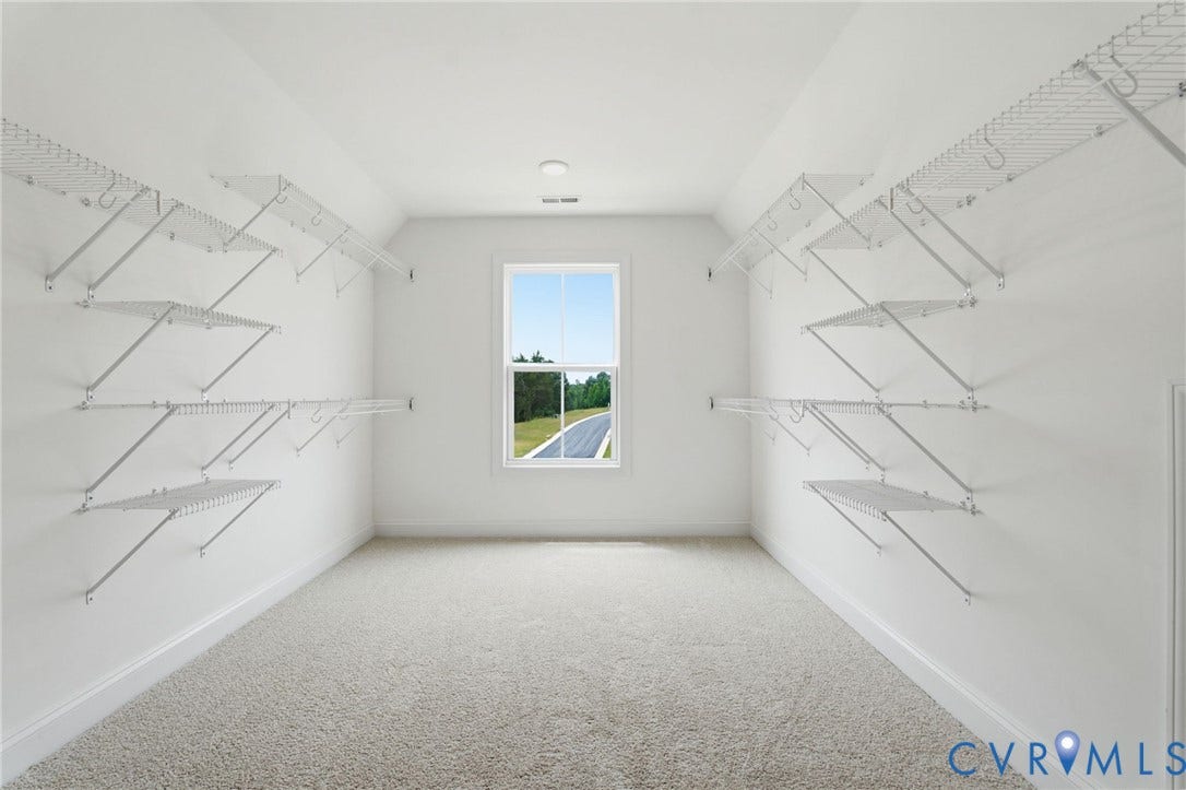 Primary Bedroom Closet -Photo represents the actual home