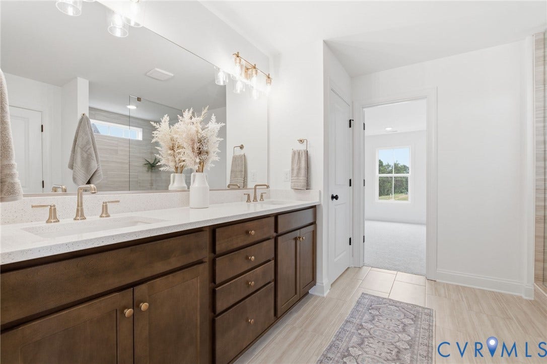 Primary Bathroom -Photo represents the actual home