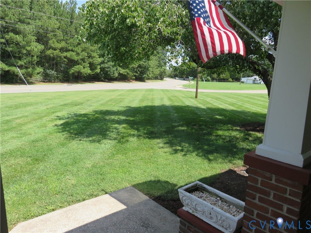 1605 Francis Road, Glen Allen, Glen Allen, VA 23059 Expansive lawn area with a concrete walkway and mature trees