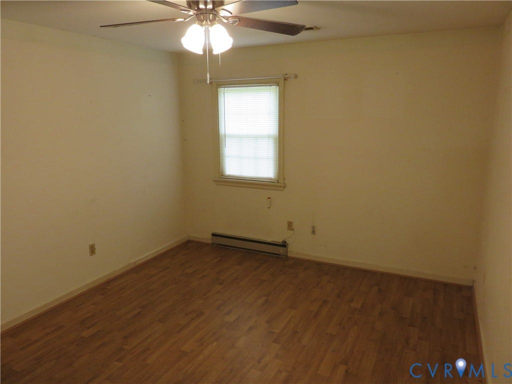 3107 Neale Street, Eastern Henrico, Richmond, VA 23223 Wood-finish flooring, ceiling fan with integrated lighting, and a window with blinds