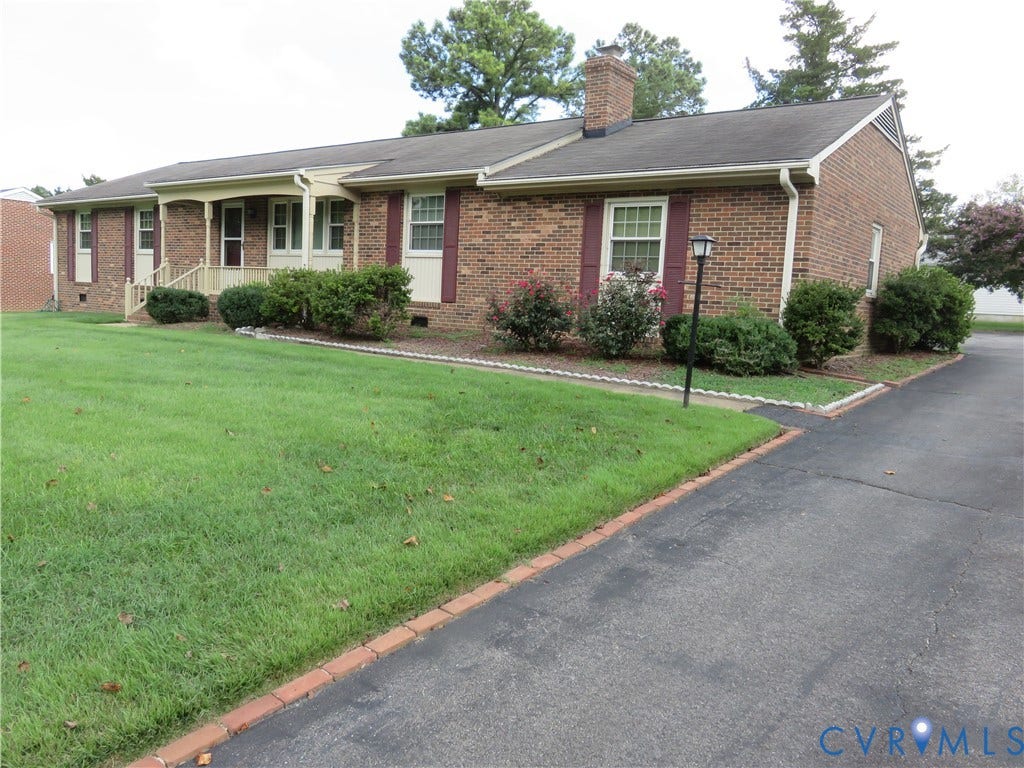 3107 Neale Street, Eastern Henrico, Richmond, VA 23223 Brick exterior with white shutters and a covered porch