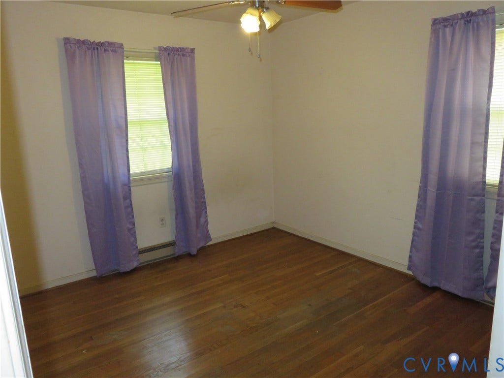 3107 Neale Street, Eastern Henrico, Richmond, VA 23223 Wood-finish flooring with white walls and a ceiling fan
