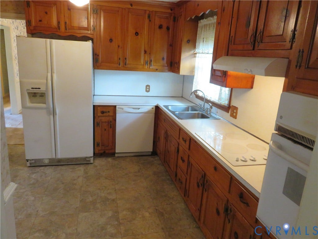 3107 Neale Street, Eastern Henrico, Richmond, VA 23223 Kitchen with wood cabinetry, white countertops, dual basin sink, and tile flooring