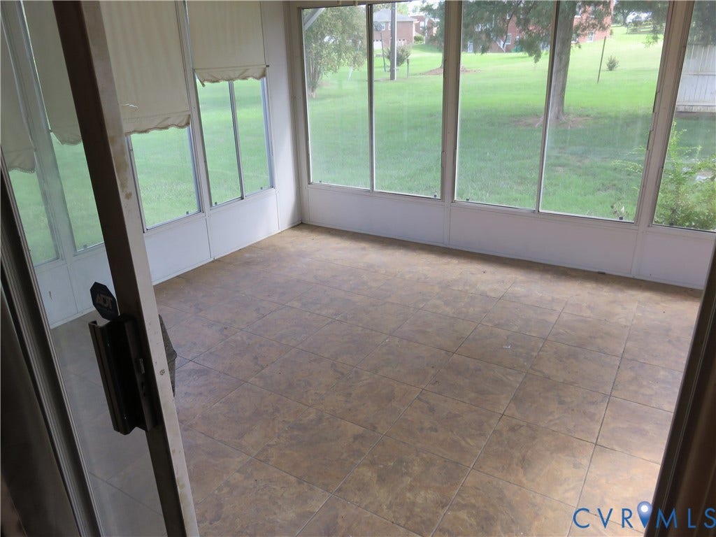 3107 Neale Street, Eastern Henrico, Richmond, VA 23223 Enclosed screened porch with tile flooring and multiple window panels