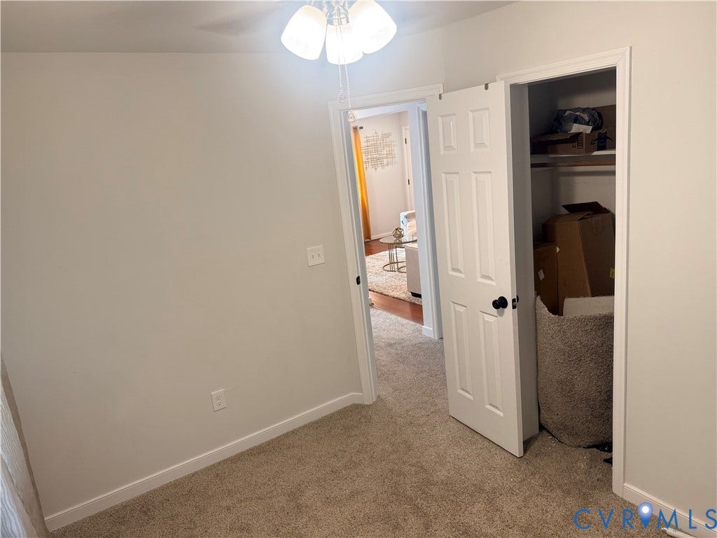 1826 Claiborne Street, Byrd Park, Richmond, VA 23220 Neutral wall finishes, carpeted flooring, white trim, and a ceiling fan with light fixture