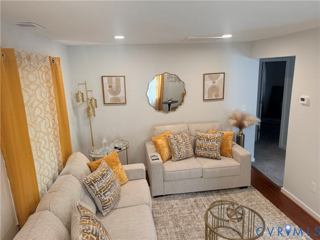 1826 Claiborne Street, Byrd Park, Richmond, VA 23220 Recessed ceiling lighting illuminates the living area, featuring light-toned walls and wood-finish flooring