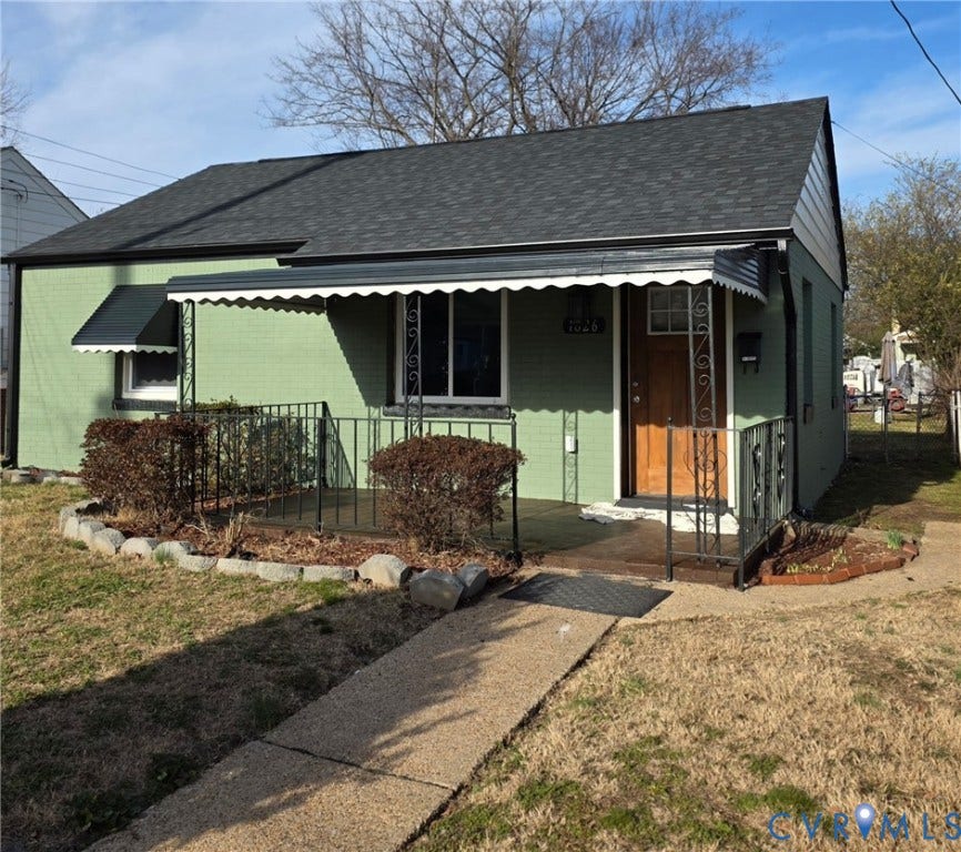 1826 Claiborne Street, Byrd Park, Richmond, VA 23220 Green painted exterior with a dark shingle roof
