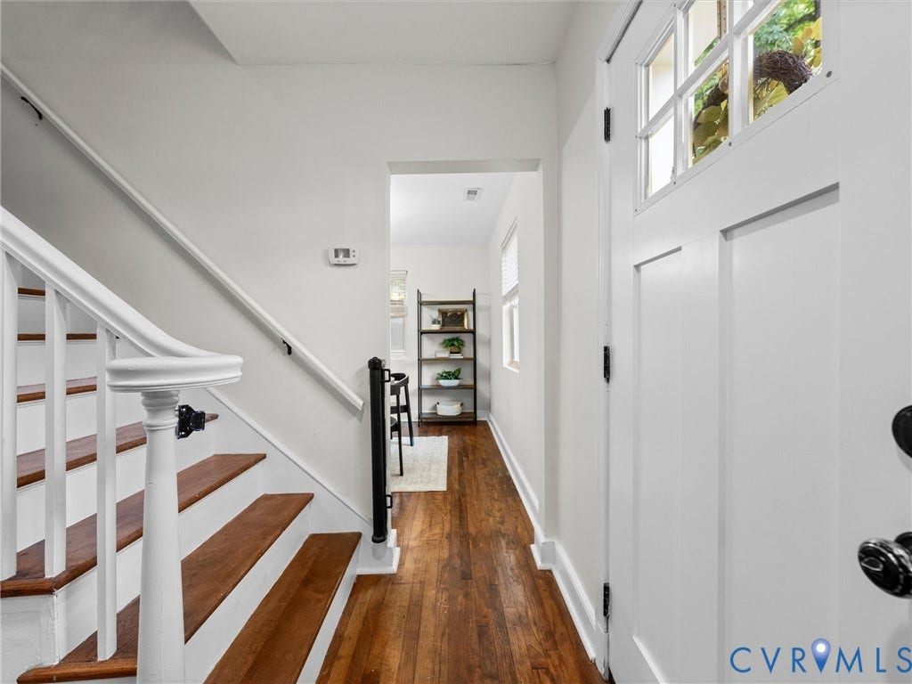 709 Ratcliffe Avenue, Richmond, VA 23222 Entryway featuring wood-finish flooring, a white paneled door with glass inserts, and a staircase with white risers and wood treads