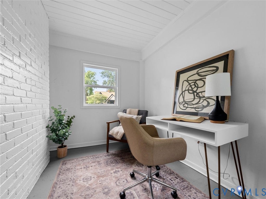 709 Ratcliffe Avenue, Richmond, VA 23222 White brick accent wall, single window, white planked ceiling, light-toned flooring, white walls