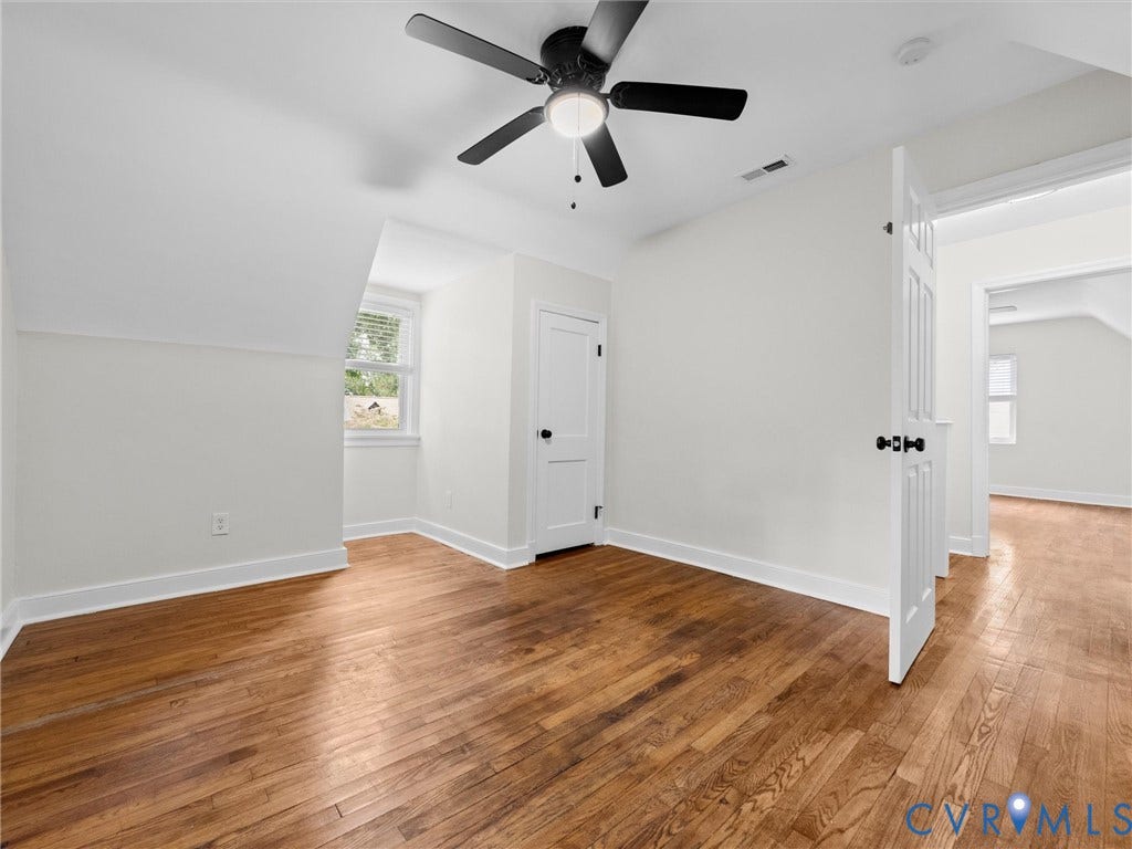 709 Ratcliffe Avenue, Richmond, VA 23222 Hardwood flooring, white walls, white trim, white doors, and a ceiling fan with integrated lighting