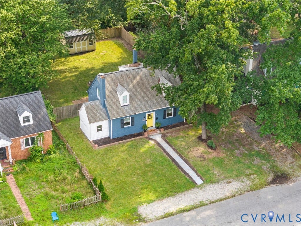 709 Ratcliffe Avenue, Richmond, VA 23222 Blue siding exterior with white trim, gray shingle roof, and a bright yellow front door
