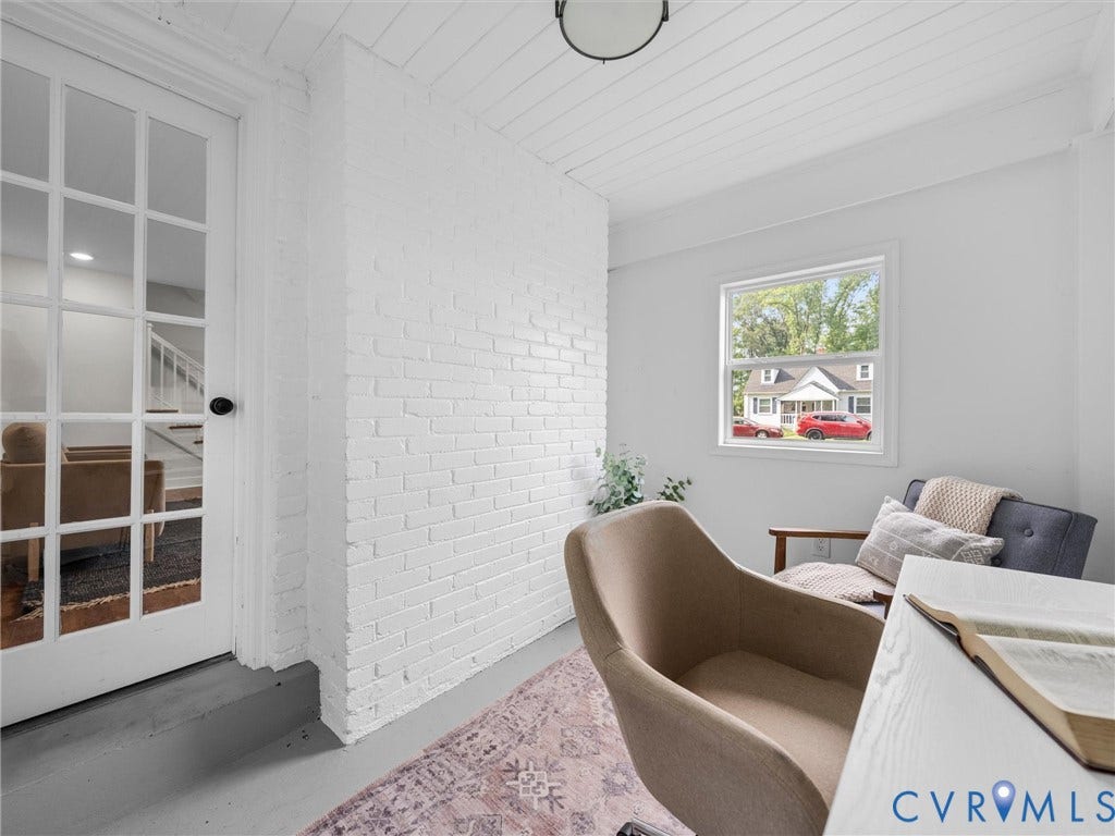 709 Ratcliffe Avenue, Richmond, VA 23222 White painted brick accent wall, paneled ceiling, recessed lighting, and a glass-paneled door