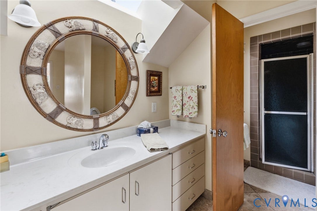 3416 Walkers Ferry Road, Walkers Ferry, Midlothian, VA 23112 White single vanity with an integrated sink, polished chrome faucet, and integrated storage cabinetry