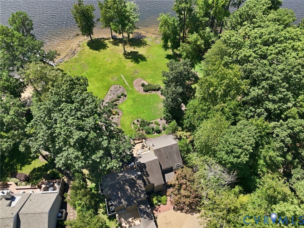 3416 Walkers Ferry Road, Walkers Ferry, Midlothian, VA 23112 Expansive waterfront property featuring a large lawn, mature trees, and landscaping