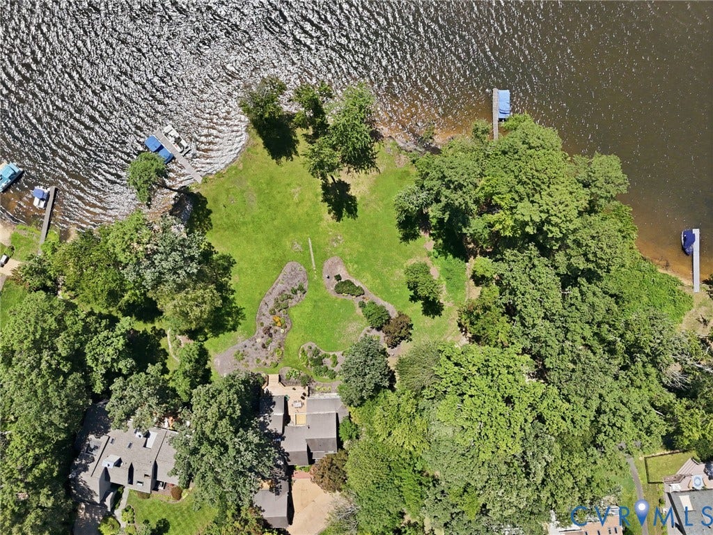 3416 Walkers Ferry Road, Walkers Ferry, Midlothian, VA 23112 Expansive waterfront property featuring mature trees, a manicured lawn, and two private docks