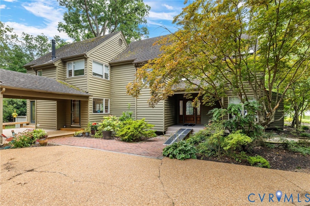 3416 Walkers Ferry Road, Walkers Ferry, Midlothian, VA 23112 Multi-level exterior with horizontal siding, covered walkway, brick paver accents, and mature landscaping